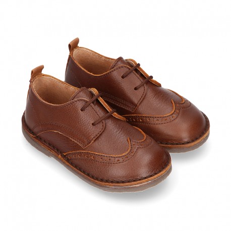 Nappa leather kids Laces up shoes with perforated design.