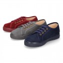 Autumn winter canvas OKAA kids tennis shoes to dress with shoelaces closure.