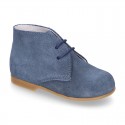 Classic suede leather ankle boots to dress for first steps.