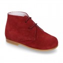 Classic suede leather ankle boots to dress for first steps.