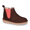 Kids ankle boots with rose elastic band and side zipper closure in suede leather.