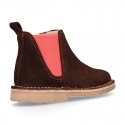 Kids ankle boots with rose elastic band and side zipper closure in suede leather.