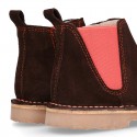 Kids ankle boots with rose elastic band and side zipper closure in suede leather.