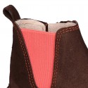 Kids ankle boots with rose elastic band and side zipper closure in suede leather.