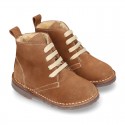 Suede leather kids ankle boots with fake hair lined.