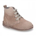 Suede leather kids ankle boots with fake hair lined.