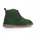 Suede leather kids ankle boots with fake hair lined.