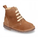 Suede leather kids ankle boots with fake hair lined.