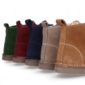 Suede leather kids ankle boots with fake hair lined.