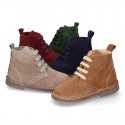 Suede leather kids ankle boots with fake hair lined.