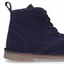 Suede leather kids ankle boots with fake hair lined.