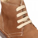 Suede leather kids ankle boots with fake hair lined.