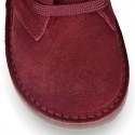 Suede leather kids ankle boots with fake hair lined.