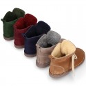 Suede leather kids ankle boots with fake hair lined.