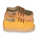 Autumn winter canvas OKAA kids tennis shoes to dress with shoelaces closure in seasonal colors.