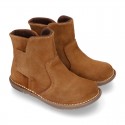 Kids ankle boots with double hook and loop strap closure in suede leather.