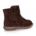 Kids ankle boots with double hook and loop strap closure in suede leather.