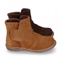 Kids ankle boots with double hook and loop strap closure in suede leather.