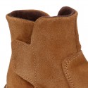 Kids ankle boots with double hook and loop strap closure in suede leather.