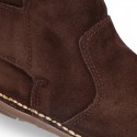 Kids ankle boots with double hook and loop strap closure in suede leather.