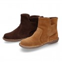 Kids ankle boots with double hook and loop strap closure in suede leather.