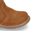 Kids ankle boots with double hook and loop strap closure in suede leather.