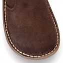 Kids ankle boots with double hook and loop strap closure in suede leather.