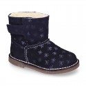 Print Suede leather Boots with hook and loop strap closure and fake hair lining.