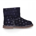 Print Suede leather Boots with hook and loop strap closure and fake hair lining.