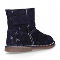 Print Suede leather Boots with hook and loop strap closure and fake hair lining.