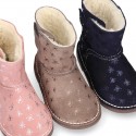 Print Suede leather Boots with hook and loop strap closure and fake hair lining.