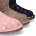 Print Suede leather Boots with hook and loop strap closure and fake hair lining.