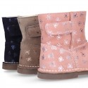 Print Suede leather Boots with hook and loop strap closure and fake hair lining.