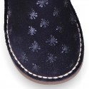 Print Suede leather Boots with hook and loop strap closure and fake hair lining.