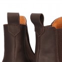 Tanned leather casual ankle boots with elastic band and thick outsole.