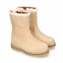 COUNTRYSIDE Suede leather ankle boots with zipper closure.