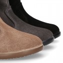 Classic kids suede leather boots with FAKE HAIR POMPONS design.