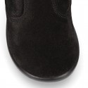 Classic kids suede leather boots with FAKE HAIR POMPONS design.
