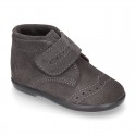 Classic kids suede leather little bootie Oxford style laceless and perforated design.