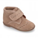 Classic kids suede leather little bootie Oxford style laceless and perforated design.