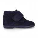 Classic kids suede leather little bootie Oxford style laceless and perforated design.