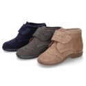 Classic kids suede leather little bootie Oxford style laceless and perforated design.