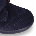 Classic kids suede leather little bootie Oxford style laceless and perforated design.