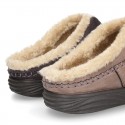 Home shoes with clog design and wool lining for large sizes.