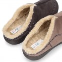 Home shoes with clog design and wool lining for large sizes.