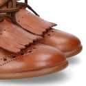 Laces up Oxford kids shoes with fringed tongue in TAN leather.