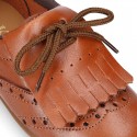 Laces up Oxford kids shoes with fringed tongue in TAN leather.