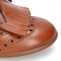 Laces up Oxford kids shoes with fringed tongue in TAN leather.