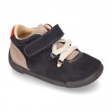 Suede leather Kids SPORT ankle boots with elastic laces and hook and loop strap closure.