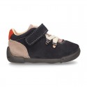 Suede leather Kids SPORT ankle boots with elastic laces and hook and loop strap closure.